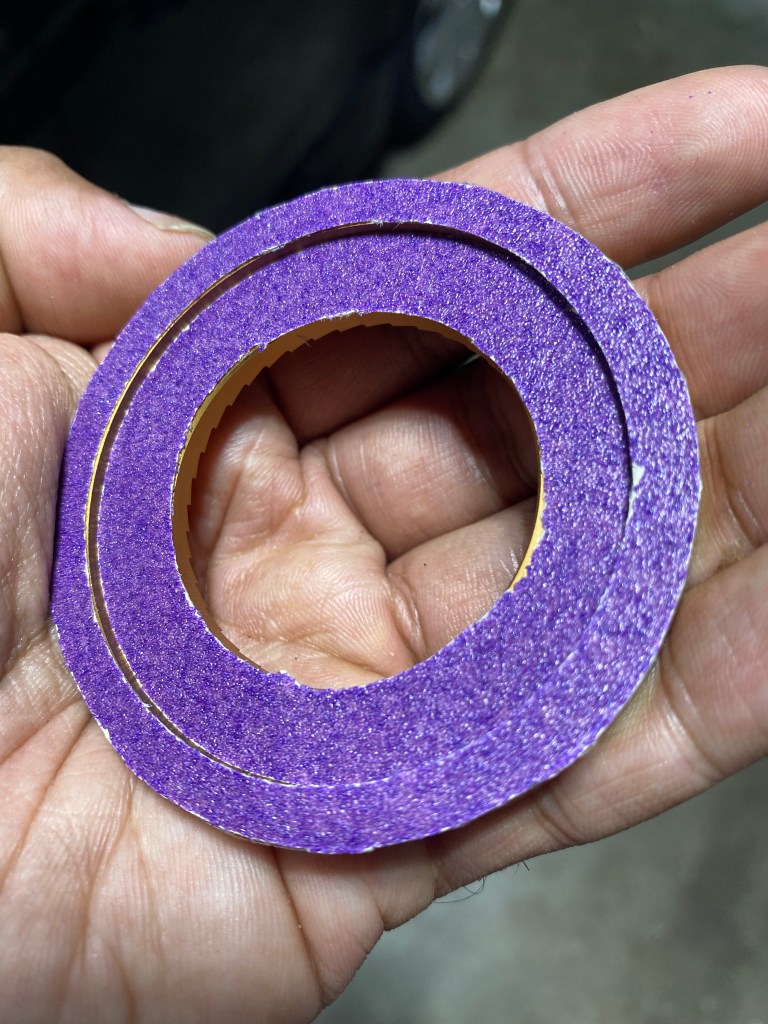 Figure 2: One of the 64MP burrs outer and inner lips of the lower surface lined with sandpaper. I later realized we only need to add it to the outer lip since that's where it contacts the carrier